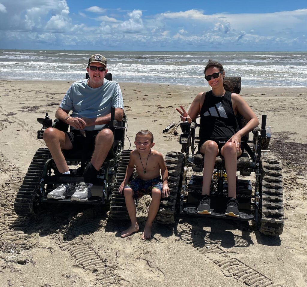 Family with Track Chairs on Beach