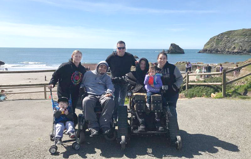 families and track chairs at beach